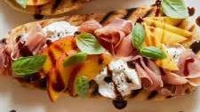 Grilled Flatbreads Topped with Peach, Prosciutto and Burrata Thumbnail