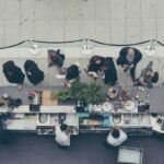 aerial view photography of people lining-up at the food counter