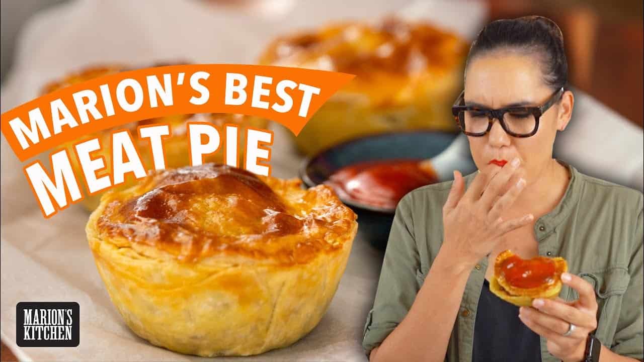 Woman enjoying a delicious meat pie, with golden crust and savory filling, highlighting the text "Mom's Best Meat Pie" in the background. Perfect for food lovers and home cooking enthusiasts.