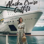 Woman in stylish outfit standing on a cruise ship deck with an Alaskan backdrop, showcasing fashion ideas for Alaska cruise outfits.