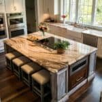 Modern kitchen featuring a large marble island with seating, built-in cooktop, and elegant cabinetry, set in a bright, airy space with natural light.