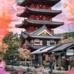 Traditional Japanese pagoda surrounded by autumn foliage and historical buildings, showcasing vibrant colors and cultural architecture.