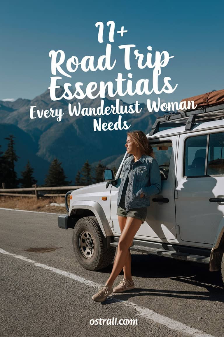 Woman standing next to a white off-road vehicle on a scenic road with mountains in the background, promoting road trip essentials for adventurous women.