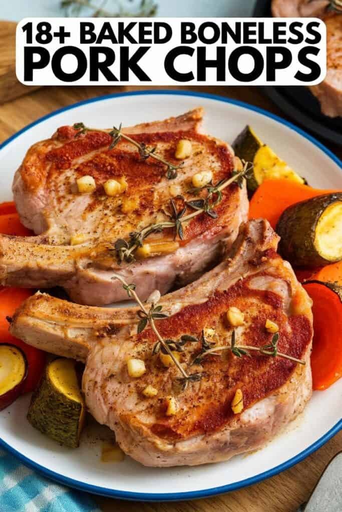 Baked boneless pork chops served on a plate with roasted vegetables, including carrots and zucchini, garnished with herbs and garlic. Ideal for a delicious and healthy meal option.