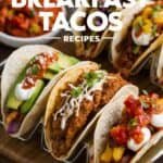 Delicious assortment of breakfast tacos featuring various toppings like avocado, salsa, and sour cream, served on a wooden platter. The image highlights 30 creative breakfast taco recipes, perfect for a flavorful morning meal.